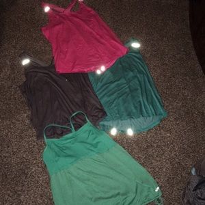 4 workout tops. All XL pink one is XXL